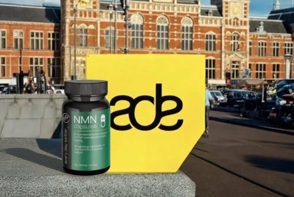 NMN ADE 2025 supplement by Every Day Better for NMN at Amsterdam Central Station during the Amsterdam Dance Event 2025, with the yellow ADE logo in the foreground.